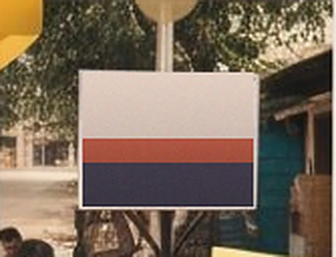 Signboard beside a small shop with a blue door
